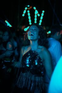 10 Life Mistakes - club scene of a woman on the dancefloor having the time of her life