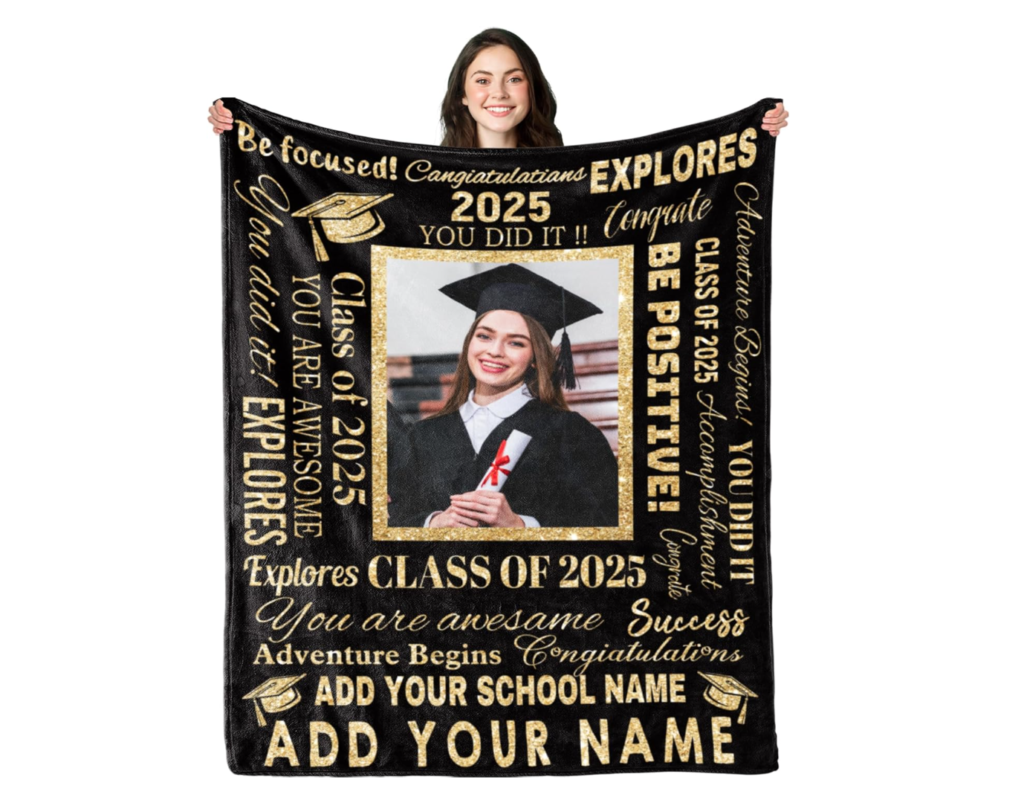 a woman holds a personalized graduation blanket with a picture of her grad picture in the middle and positive words surrounding the pic