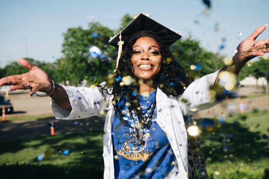 a young woman in her cap and gown on graduation day