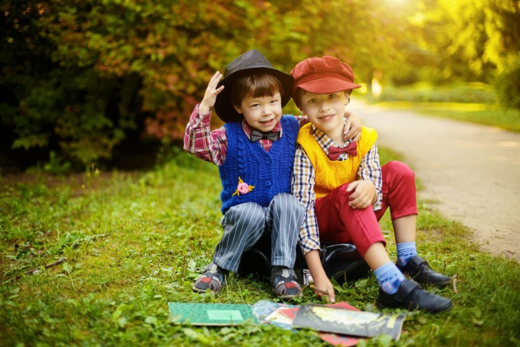thankful quotes for november - 2 adorable kids dressed in fall attire outside enjoying the fall leaves and autumn atmosphere