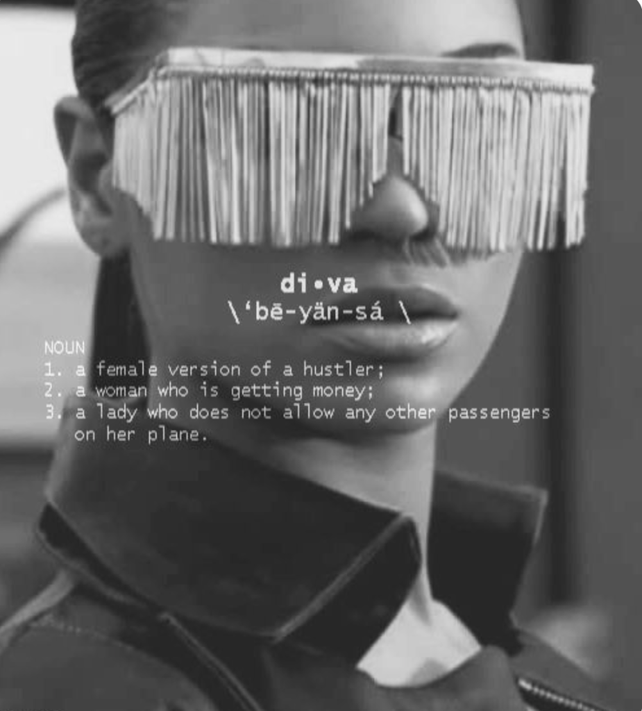 Beyonce "Diva" video image. She wears rectangular shades with metal fringes that cover her eyes