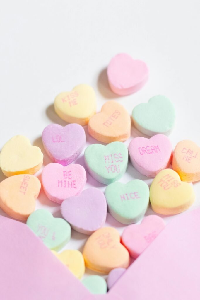 an image of an assortment of valentine's day candy that says, "BE MINE"