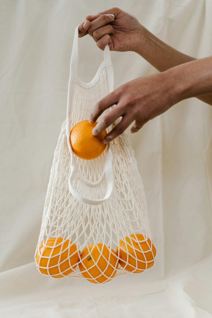 Vitamin C is represented here by a bag of oranges