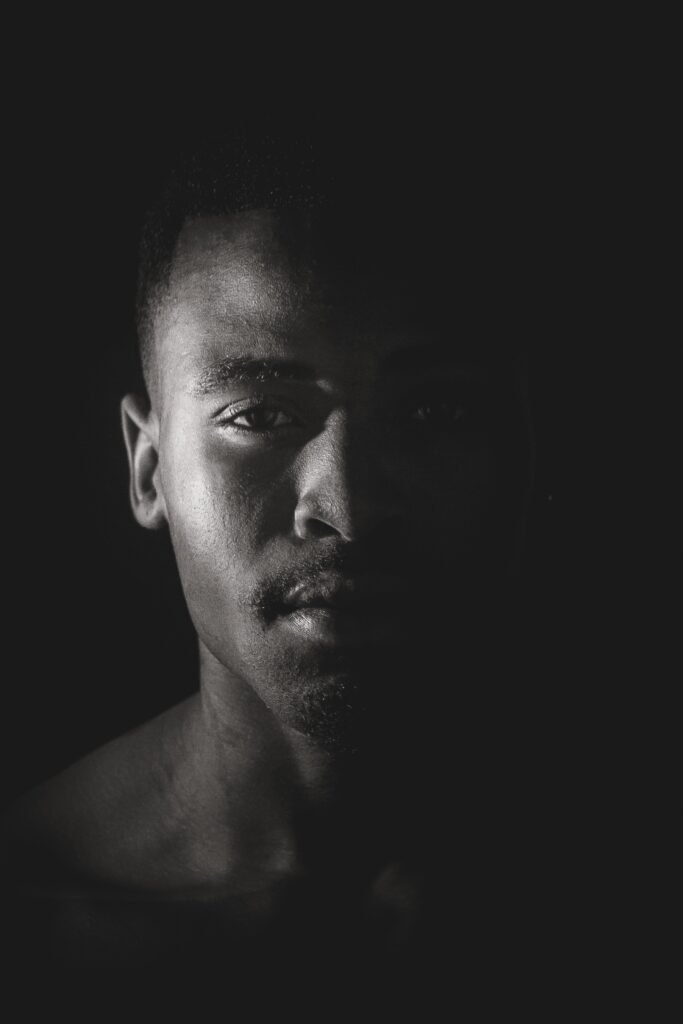 Skincare for Dark Skin Men - a black & white portrait of an African American male model's face