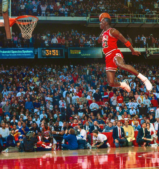 Inspirational Quotes for young black males -- a young Air michael jordan flying in for his usual dunk on the court