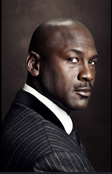 a headshot of Michael Jordan in a suit