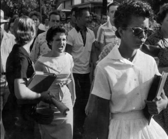 Inspirational quotes from black history - The civil rights movement in blakc and white photos — Students of Central High School in Little Rock, Arkansas, shout insults at Elizabeth Eckford as she walks toward the school building on the first day of school in 1957. Schools in Arkansas integrated races after the Supreme Court ruling in Brown v. Board of Education.