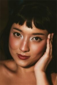 best mask for glass skin -a woman's headshot with beautiful skin