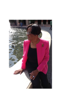 miss my mom on mother's day quotes - the author's late mother sitting on the edge of a water fountain outside of a restaurant dressed to kill on a sunny Mother's Day Sunday