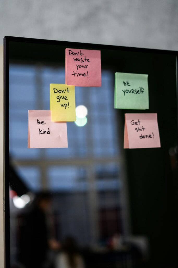 How to Overcome Procrastination for Students - reminders on post-it notes stuck to a mirror