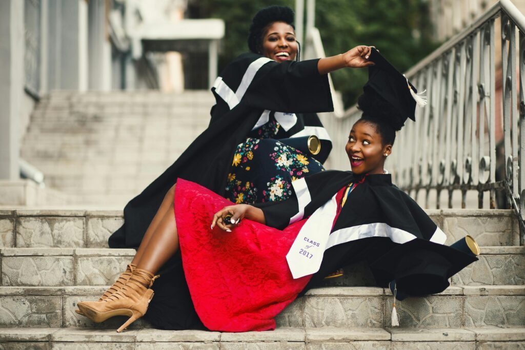 30 day blog challenge - graduation day...2 girls in their caps and gowns taking a silly but heartfelt picture