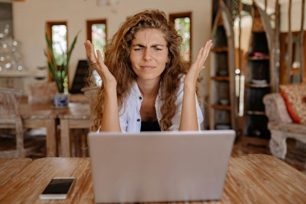 get your life together - a frustrated woman stares at her laptop in confusion
