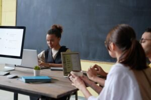 popular back to school items - a 21st century classroom with 3 students on tech devices