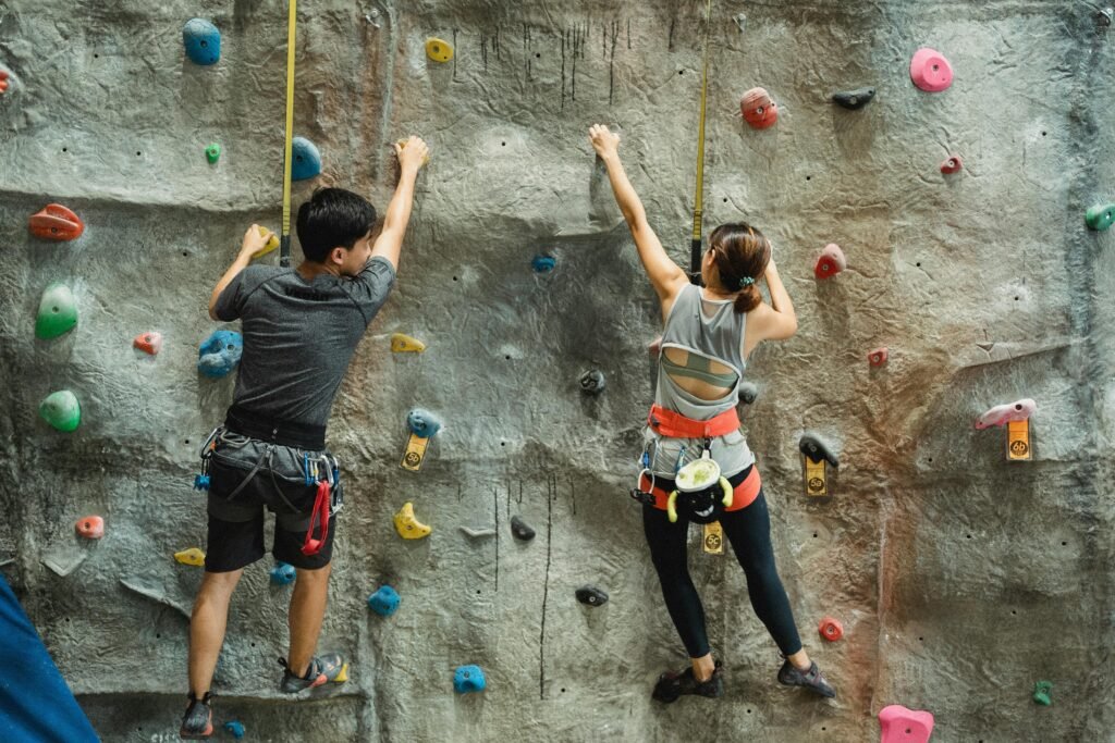 labor day weekend ideas for couples - a couple indoor rock climbing together