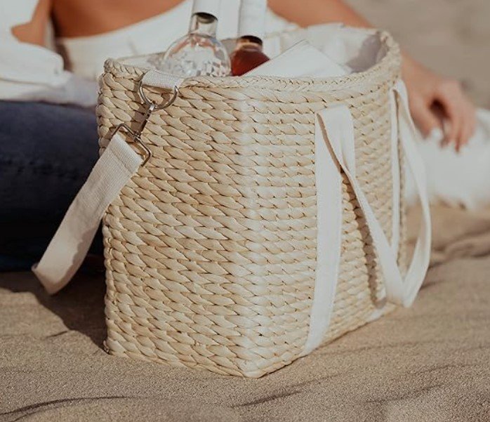 a woven cooler tote bag filled with beverages